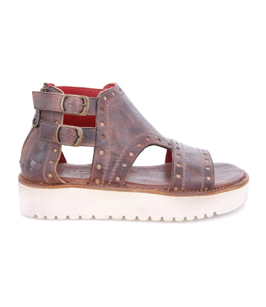 A women's brown leather Camden sandal with studs and a white sole by Bed Stu.