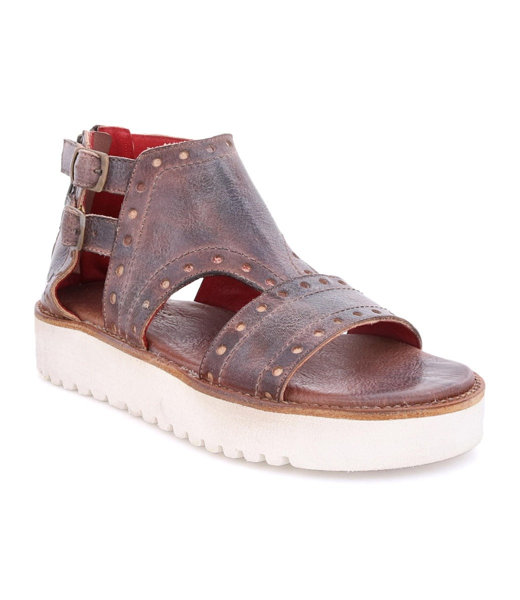 A women's brown Camden sandal with studded straps and a white sole by Bed Stu.