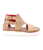 A women's Camden sandal by Bed Stu with two straps and a white sole.
