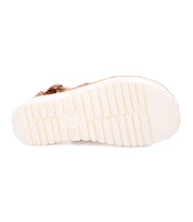 A pair of Bed Stu Camden women's sandals with white soles on a white background.