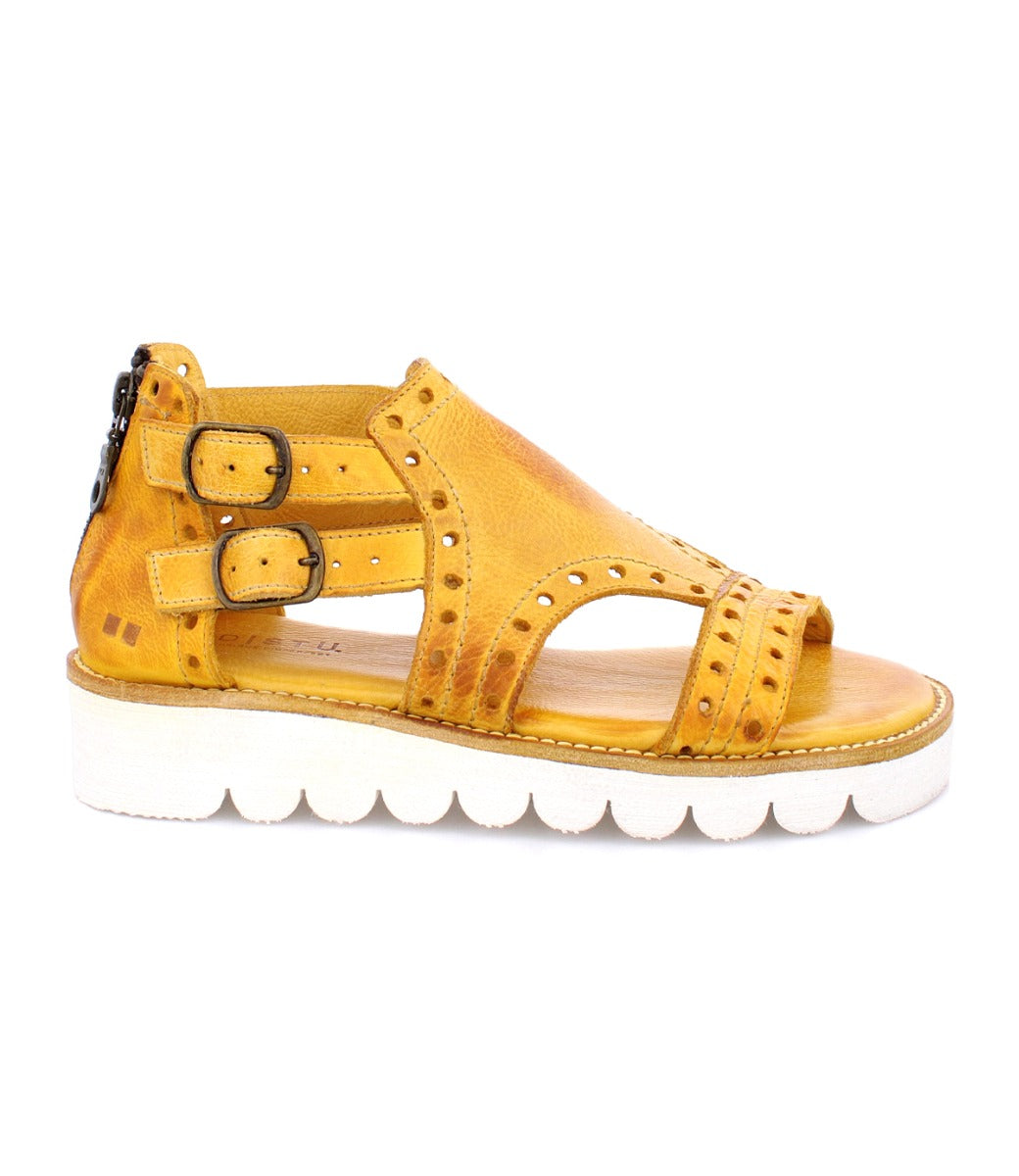 A women's yellow Camden sandal with buckles and a white sole by Bed Stu.