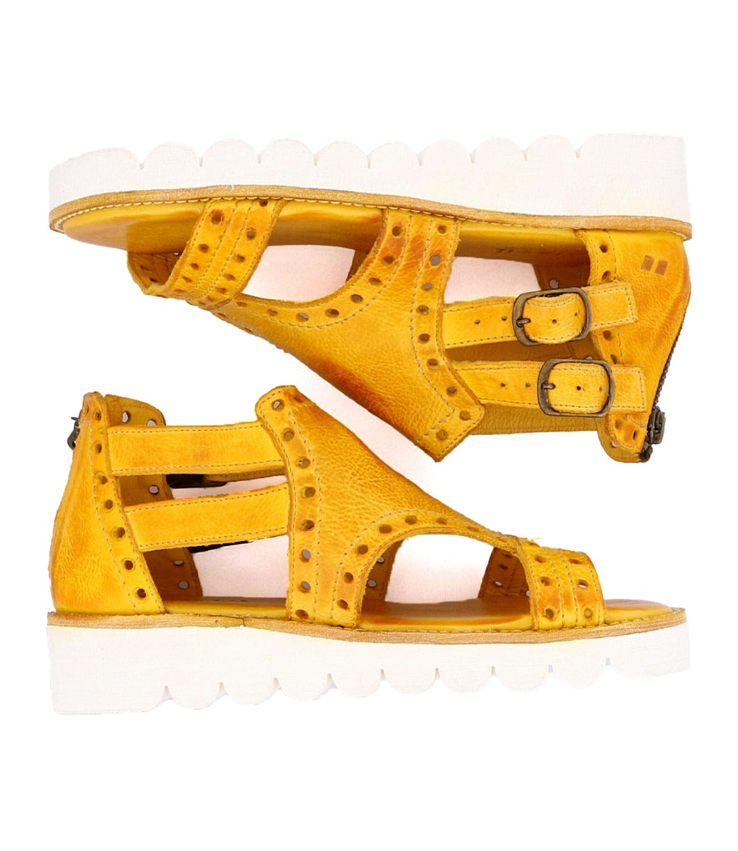 A pair of yellow Bed Stu Camden sandals with studded details.