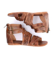 A pair of Capriana women's brown sandals with straps and buckles. Brand: Bed Stu.