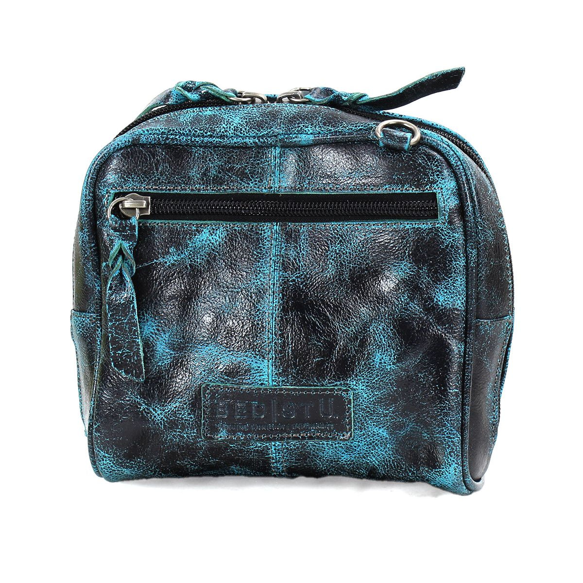 A worn black and teal leather compact bag, called Capture by Bed Stu, features a zippered front pocket, artisan-made finishes, and a visible brand logo on the bottom panel.