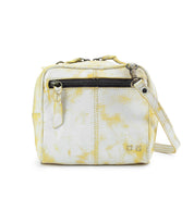 Compact and chic, the Capture handbag by Bed Stu features a yellow and white pattern with a front zipper pocket and side strap, beautifully enhanced by artisan-made finishes.