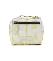 The Capture is a cream and yellow marbled leather bag by Bed Stu, featuring a front zipper pocket, top handle, artisan-made finishes, and an eco-friendly leather design. The brand logo "BED|STÜ" is prominently displayed on the front.
