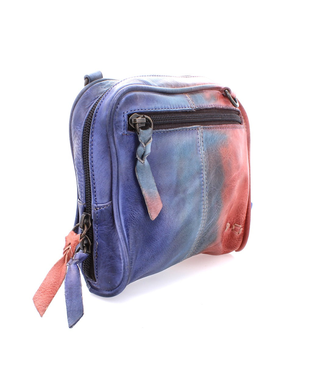 A small Capture purse with a tie dye pattern on it.