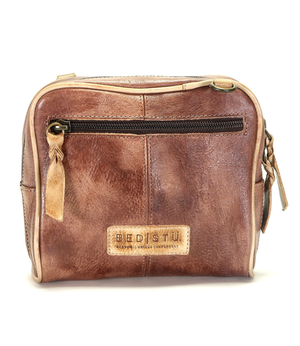 A brown leather Capture cross body bag with a zipper by Bed Stu.