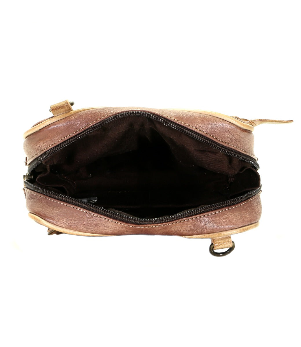 The inside of a Capture brown purse with a zipper from Bed Stu.