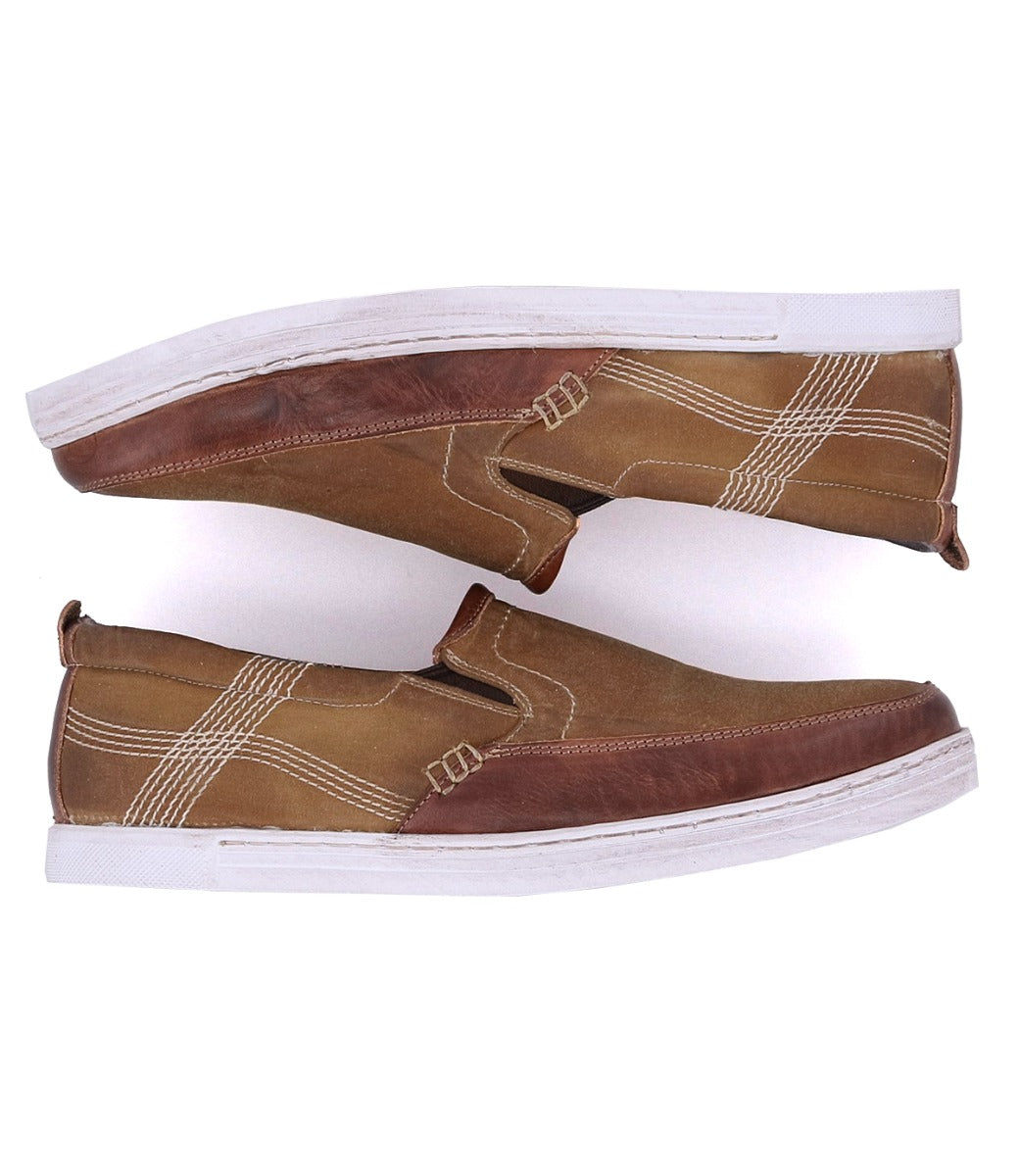 A pair of Bed Stu Carp brown slip on shoes on a white background.