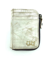 A Bed Stu Carrie white leather wallet with a logo on it.
