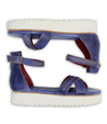 A pair of Bed Stu Carroll platform sandals with red soles.