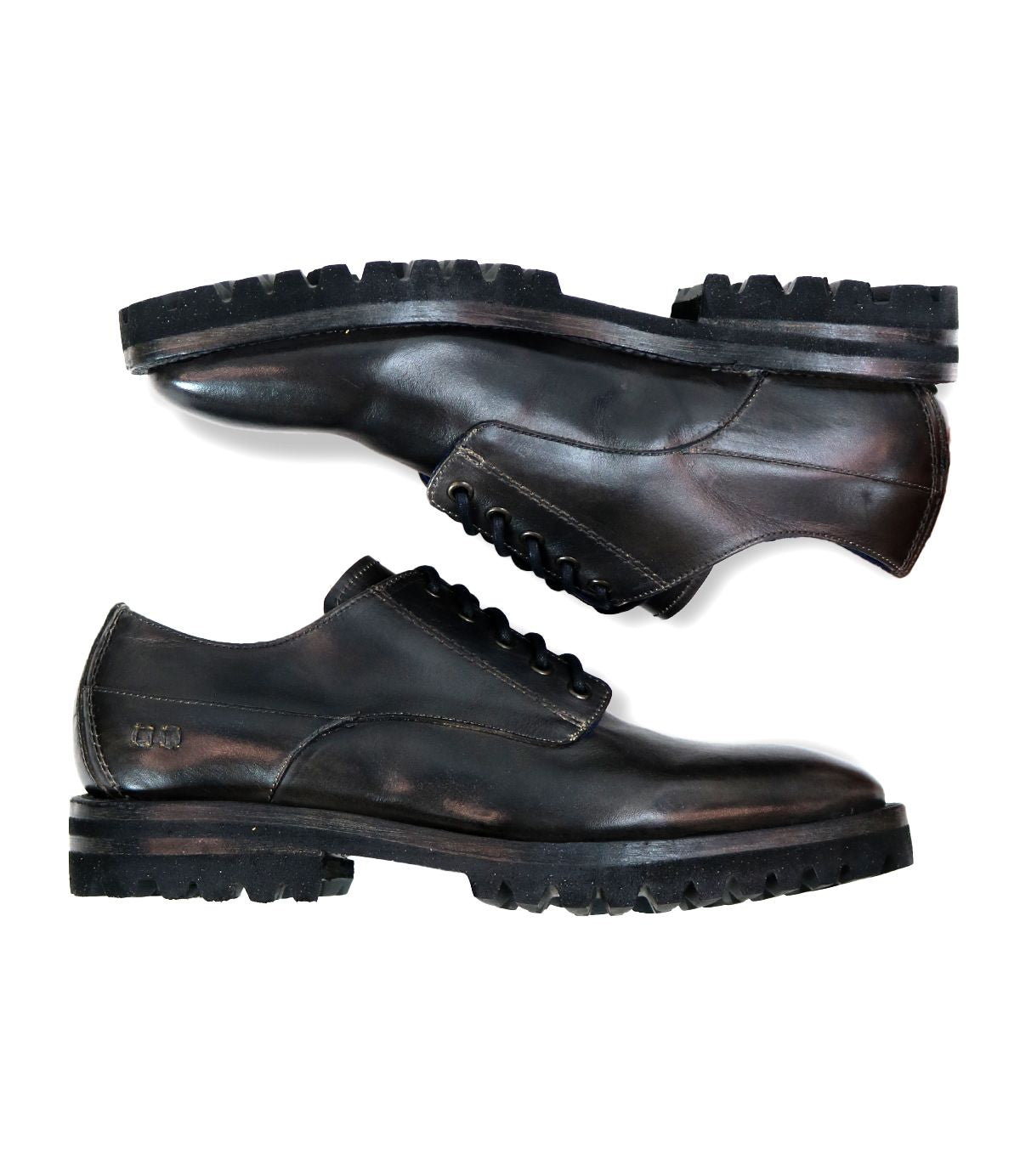 Two Carter black leather men's oxford dress shoes by Bed Stu, featuring thick rubber soles and crafted with Goodyear welt construction, are positioned side by side on a white background.