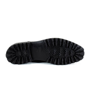 The image features the underside of the Carter shoe by Bed Stu, showcasing a rugged, textured sole designed for optimal traction and built with Goodyear welt construction for enhanced durability.
