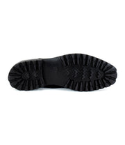 The image features the underside of the Carter shoe by Bed Stu, showcasing a rugged, textured sole designed for optimal traction and built with Goodyear welt construction for enhanced durability.