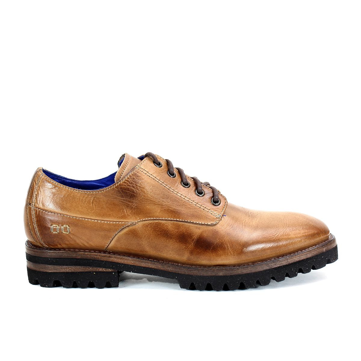 The Carter by Bed Stu is a men's oxford in an elegant brown, crafted from vegetable-tanned leather. This lace-up shoe features a durable black treaded sole and boasts Goodyear welt construction, showcased beautifully in the side view.