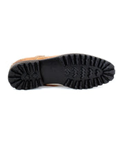 The image displays the underside of the Carter shoe by Bed Stu, featuring a black, rugged tread designed for traction and showcasing Goodyear welt construction for enhanced durability.