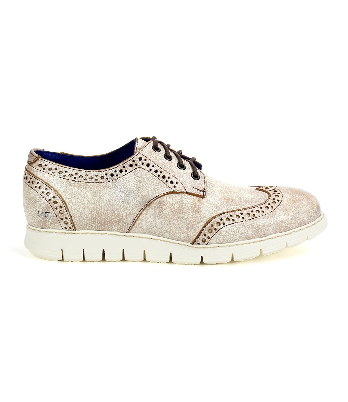 The Cayuga II by Bed Stu is a beige leather oxford shoe with stylish brogue details and decorative perforations, featuring a thick white rubber sole. This lightweight leather derby also has brown laces and a blue interior lining, encapsulating a contemporary casual male style.