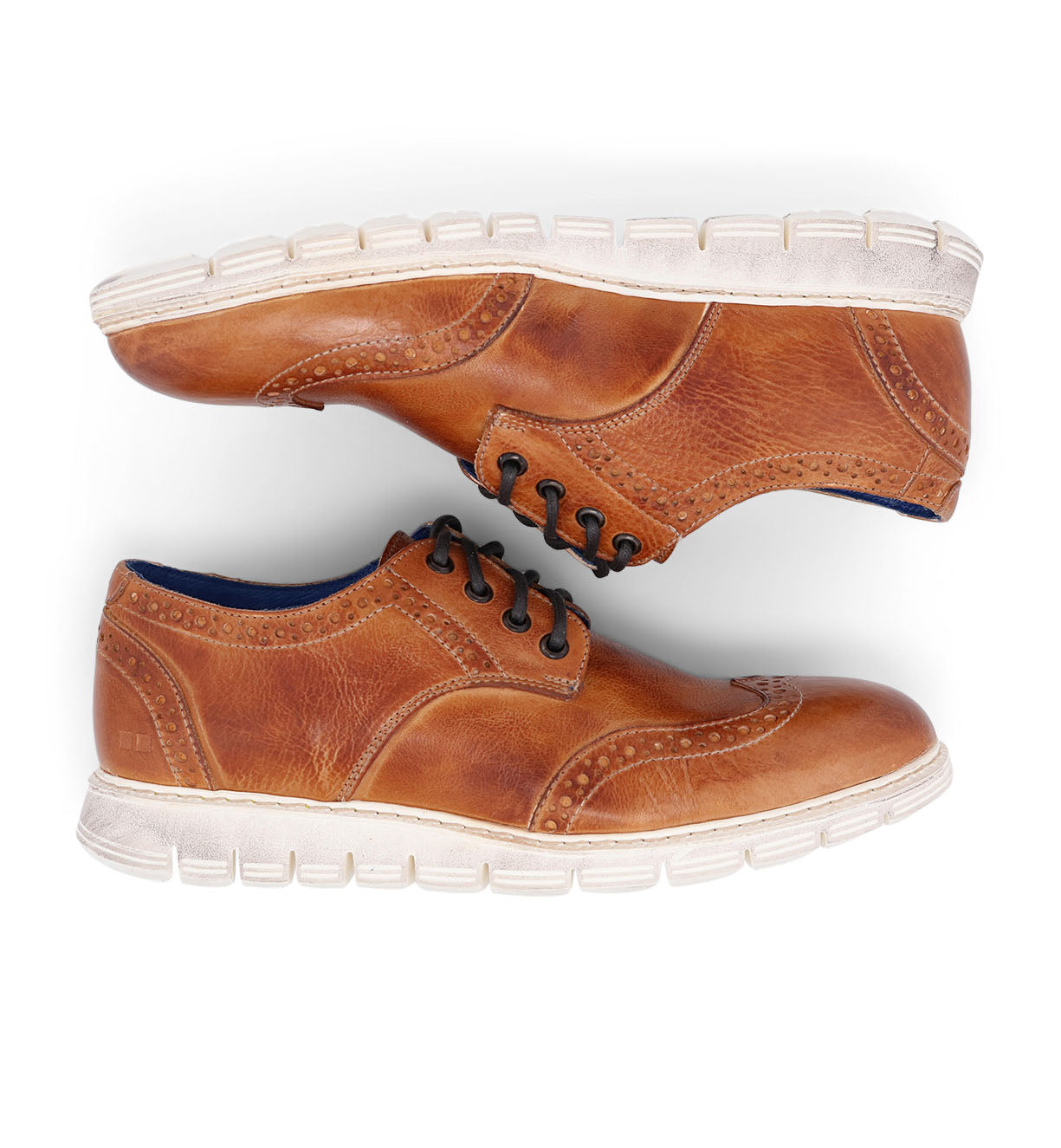 A pair of Bed Stu Cayuga II men's tan wingtip shoes on a white background.