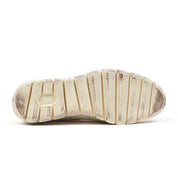 Sole of a well-worn Bed Stu Cayuga II leather running shoe on a white background.