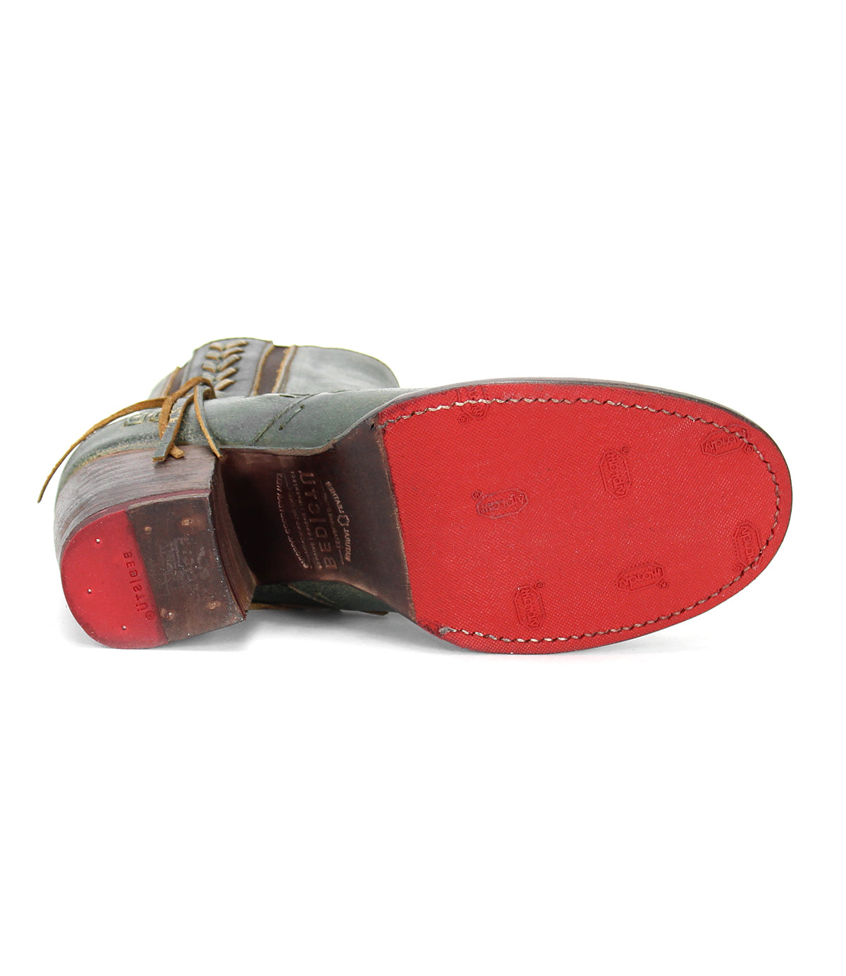 A pair of Bed Stu Celestine shoes with a red sole and a green sole.