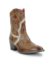 The Bed Stu Chamise is a brown leather western boot with decorative stitching, stud accents, leather inlays, a short heel, and a classic snip toe. Photographed against a white background.