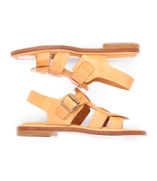 A Italian made sandal is natural color with fisherman style