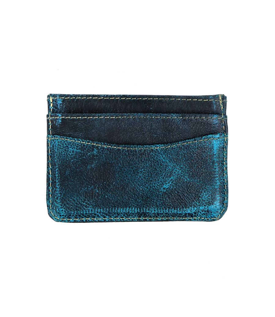 The Bed Stu Chuck is a compact, light-colored leather cardholder featuring visible stitching, multiple card slots, and a small square logo in the lower right corner.