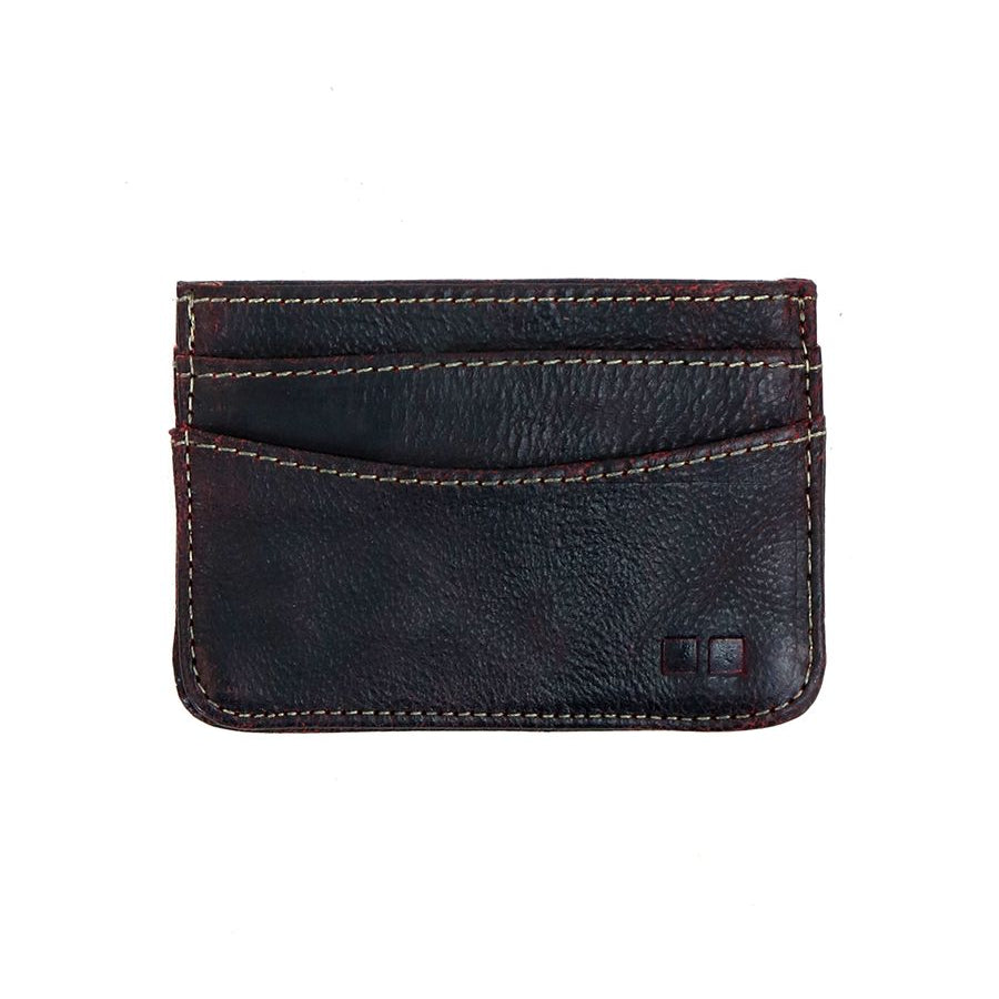 The Chuck card wallet by Bed Stu is a convenient and compact black leather accessory, featuring three visible slots and eye-catching red stitching details.