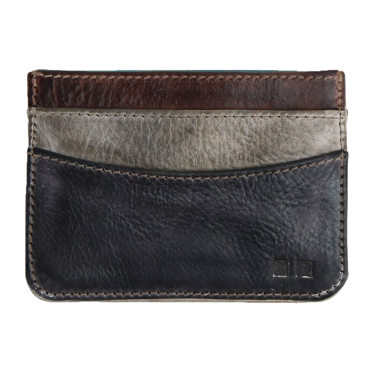 The Chuck by Bed Stu is a compact leather card wallet with three pockets in black, gray, and brown. It features visible stitching and a small logo in the bottom right corner, designed for everyday use.