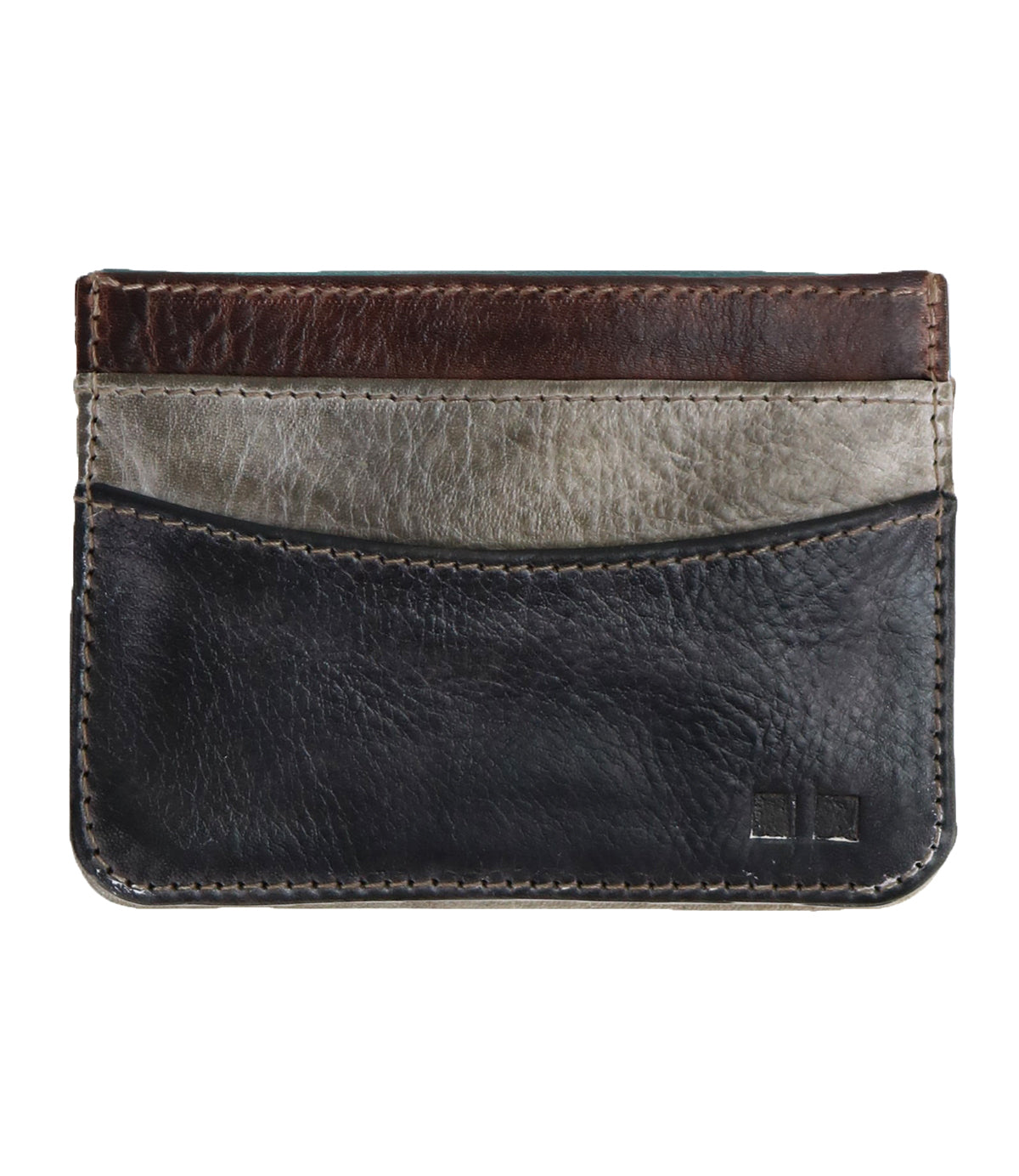 The Chuck by Bed Stu is a compact leather card wallet with three pockets in black, gray, and brown. It features visible stitching and a small logo in the bottom right corner, designed for everyday use.