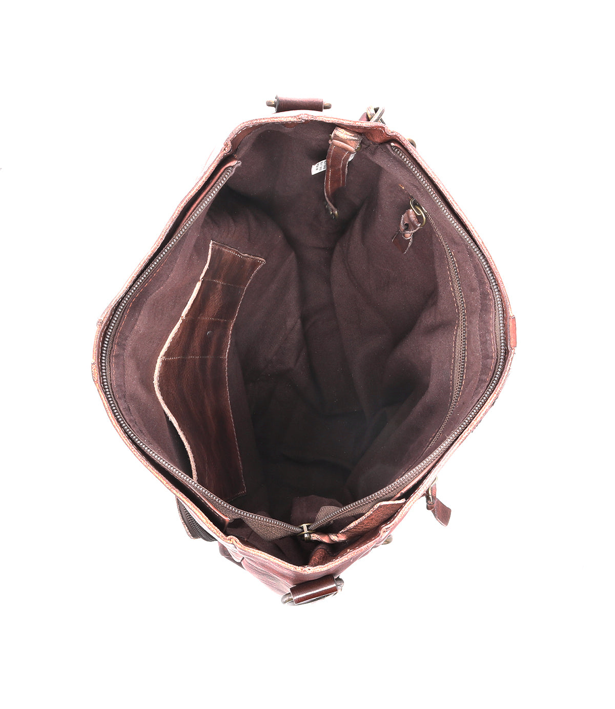 The inside of a Cirdan brown leather backpack by Bed Stu.