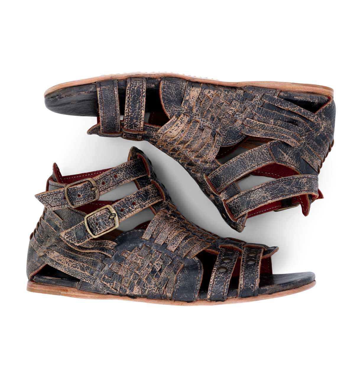 A pair of brown Bed Stu Claire gladiator sandals on a white background.