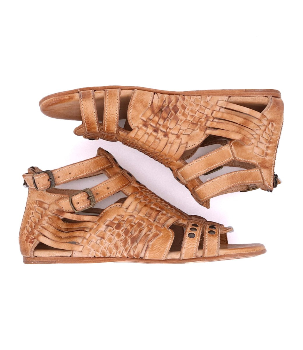 A pair of Bed Stu tan sandals with braided straps named Claire III.
