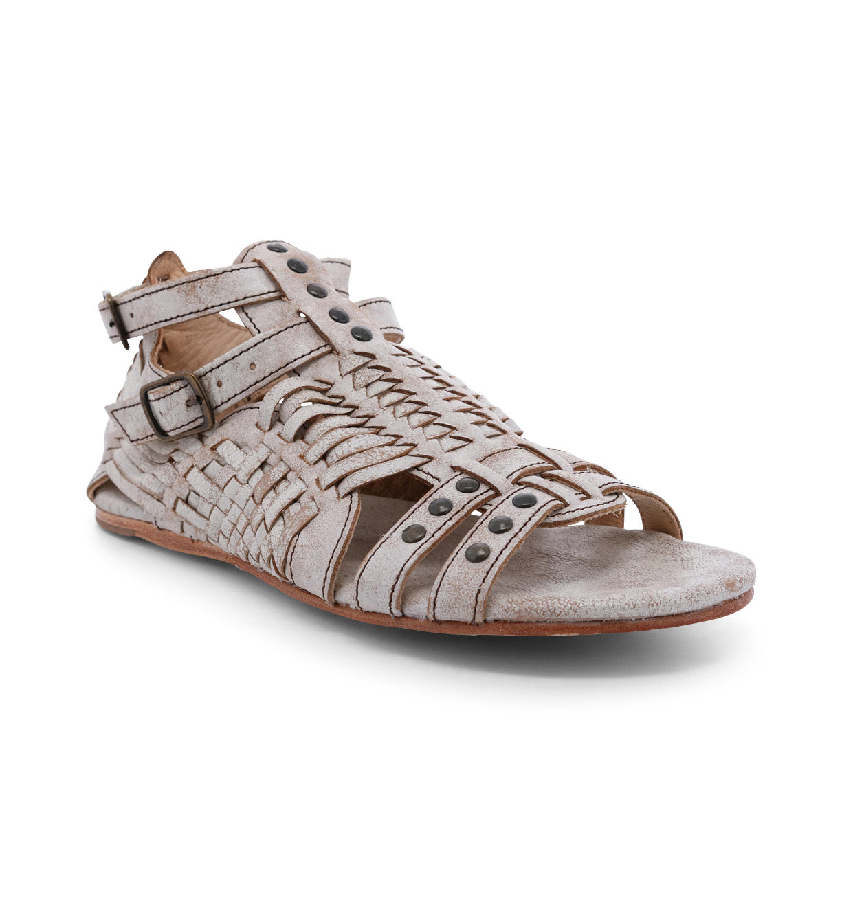 A women's sandal with braided straps and buckles called the Claire by Bed Stu.