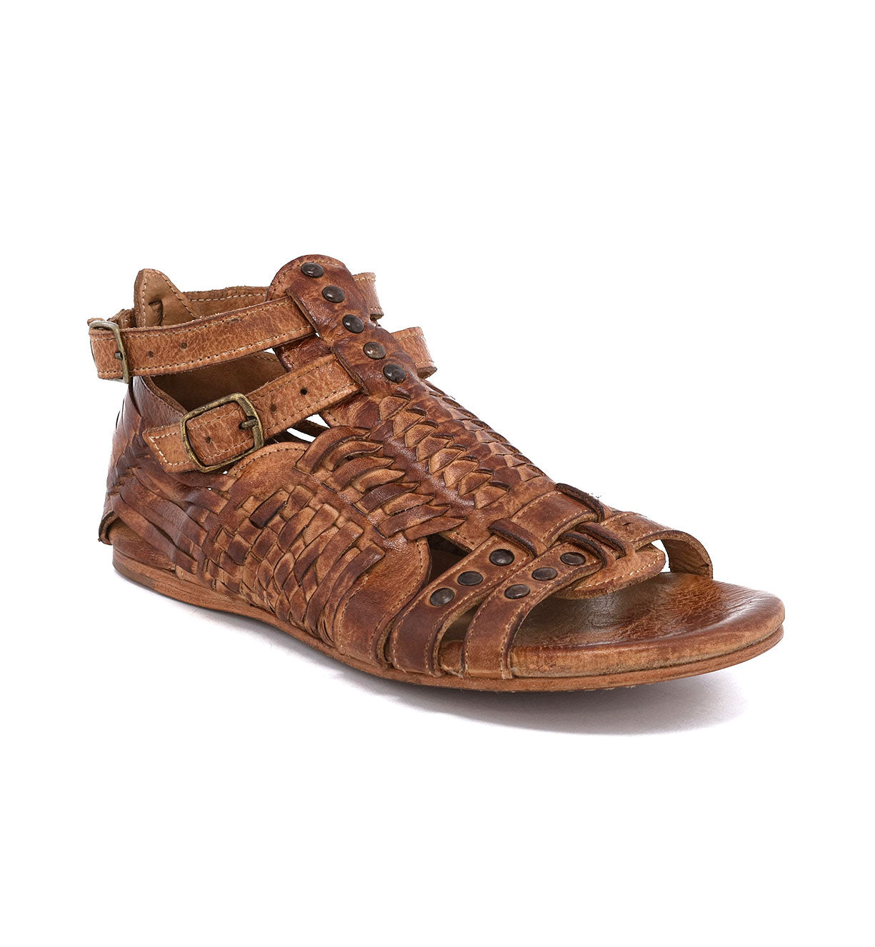 A pair of brown Claire sandals with straps and buckles by Bed Stu.