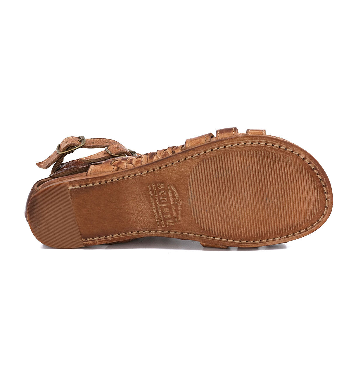 A pair of brown Claire sandals with buckles and straps by Bed Stu.