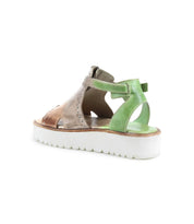 The Bed Stu Clancy sandal features a chunky white XL EXTRALIGHT platform sole and tan and green leather upper, adorned with metal grommet details, shown from the back.