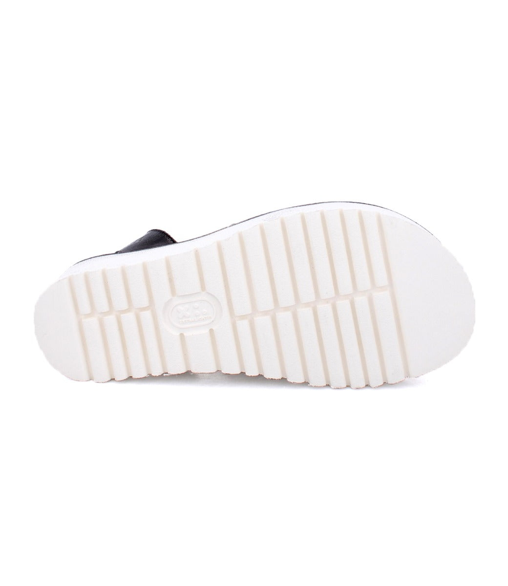 White sole of Clancy black leather sandals by Bed Stu.