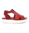 A Clancy sandal by Bed Stu, made of red leather with a white sole.