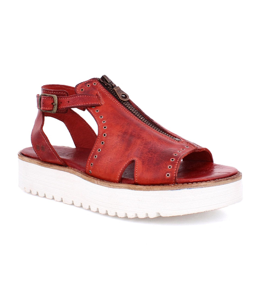 A Clancy sandal by Bed Stu, made of red pure leather with a white sole.