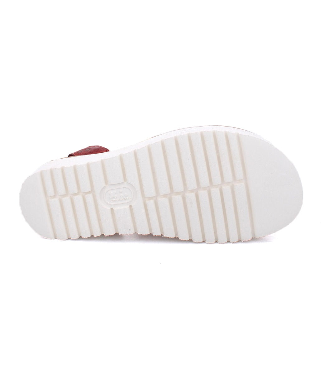 White sole of Clancy red leather sandals by Bed Stu.