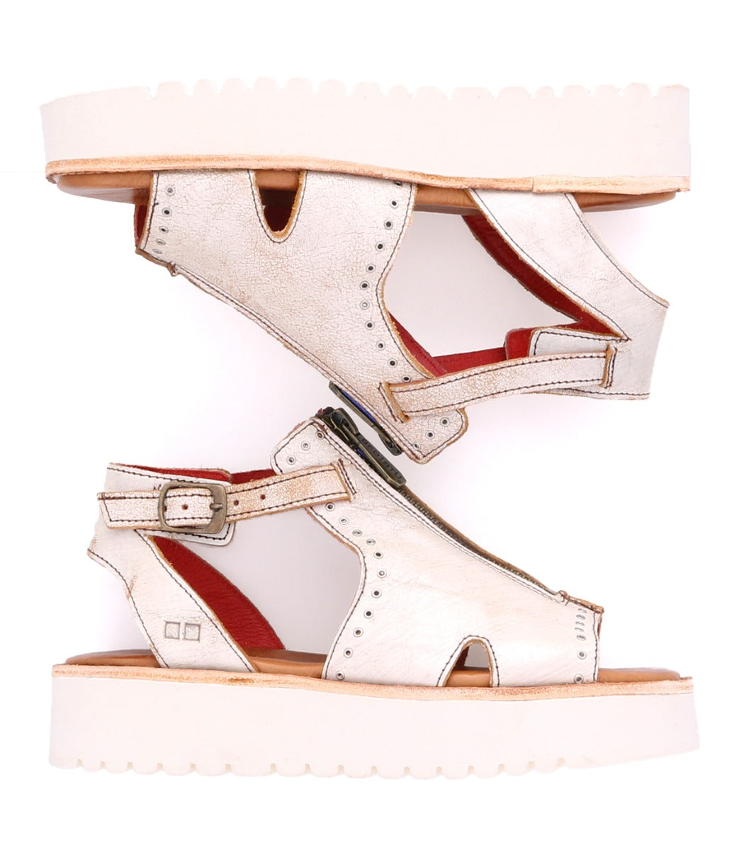 A pair of Clancy white leather sandal with white sole by Bed Stu.