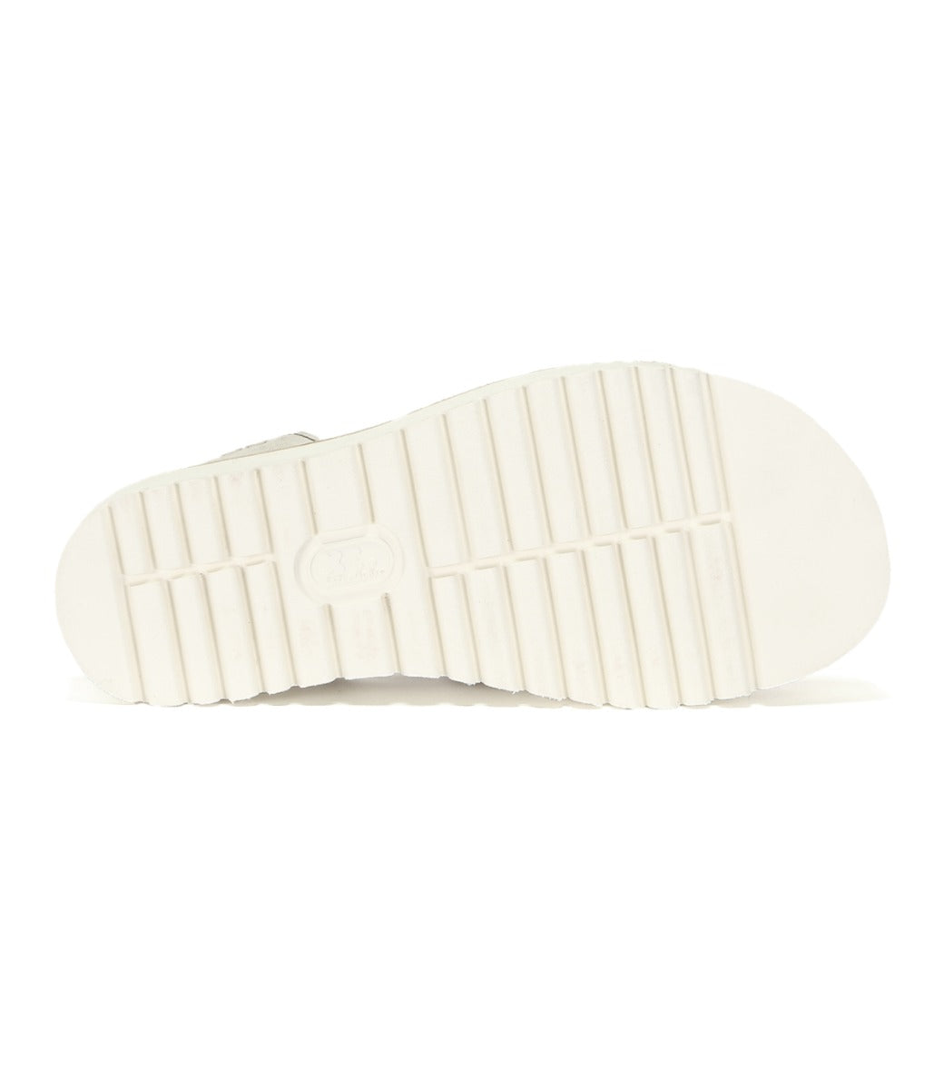 White sole of Clancy white leather sandals by Bed Stu.