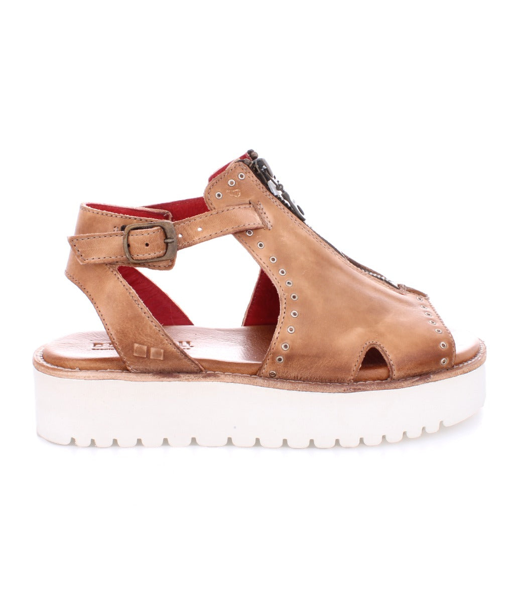 A Clancy sandal by Bed Stu, made of tan leather with a white sole.