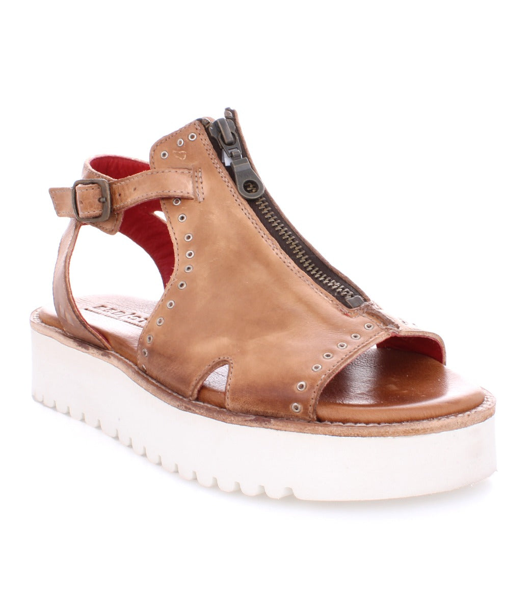 A Clancy sandal by Bed Stu, made of tan pure leather with a white sole.