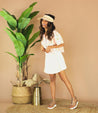 Woman wearing Clancy white pure leather sandal with white sole by Bed Stu.