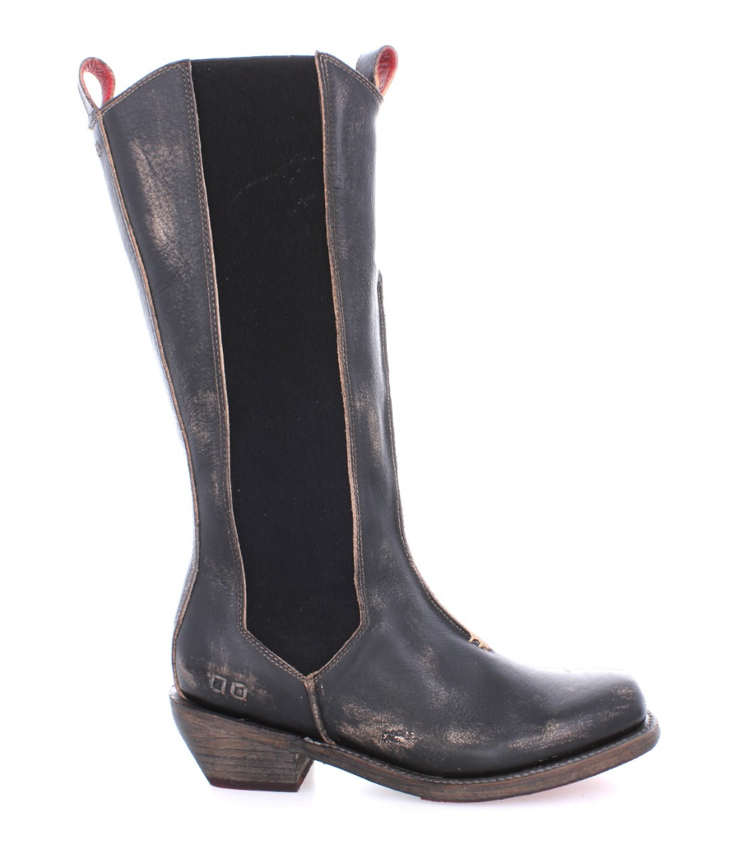 A women's Clarisse cowboy boot by Bed Stu with a red sole.