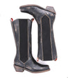 A pair of Clarisse boots on a white background, made by Bed Stu.