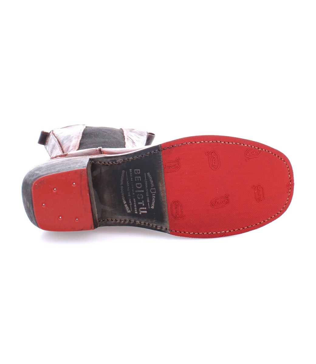A pair of Clarisse shoes with red soles on a white background by Bed Stu.